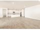 Open concept kitchen with island and granite countertops at 36954 W La Paz St, Maricopa, AZ 85138