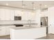 Modern kitchen with white cabinets and granite countertops at 36954 W La Paz St, Maricopa, AZ 85138
