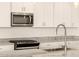 Modern kitchen with stainless steel appliances and granite countertops at 36954 W La Paz St, Maricopa, AZ 85138