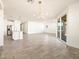Open living room with kitchen island and sliding glass door at 36954 W La Paz St, Maricopa, AZ 85138
