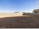 Large backyard with block wall and desert landscape at 37406 W San Clemente St, Maricopa, AZ 85138