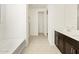 Bathroom with soaking tub and double vanity at 37406 W San Clemente St, Maricopa, AZ 85138