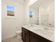 Bathroom with double vanity, a large mirror and bathtub at 37406 W San Clemente St, Maricopa, AZ 85138