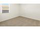 Simple bedroom with carpeted floor and window at 37406 W San Clemente St, Maricopa, AZ 85138