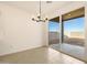 Bright dining area with sliding door to backyard at 37406 W San Clemente St, Maricopa, AZ 85138