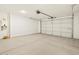 Spacious garage with overhead door and extra space at 37406 W San Clemente St, Maricopa, AZ 85138