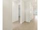 Bright hallway with tile flooring and access to bedrooms at 37406 W San Clemente St, Maricopa, AZ 85138