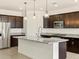 Modern kitchen with stainless steel appliances and granite countertops at 37406 W San Clemente St, Maricopa, AZ 85138