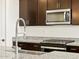 Modern kitchen with stainless steel appliances and granite countertops at 37406 W San Clemente St, Maricopa, AZ 85138