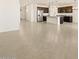 Spacious living room with open floor plan and tile flooring at 37406 W San Clemente St, Maricopa, AZ 85138