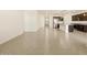 Open living room with view into kitchen area at 37406 W San Clemente St, Maricopa, AZ 85138