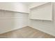 Large walk-in closet with double hanging rods at 37406 W San Clemente St, Maricopa, AZ 85138
