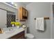 Clean bathroom with a single sink vanity and shower/tub combo at 4121 W Medlock Dr, Phoenix, AZ 85019