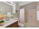 Updated bathroom with a vanity and a tub shower combo at 4121 W Medlock Dr, Phoenix, AZ 85019