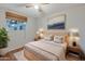 Bedroom with light wood furniture and large window at 4121 W Medlock Dr, Phoenix, AZ 85019