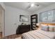 Bright bedroom with a comfortable bed, dresser, and shelving at 4121 W Medlock Dr, Phoenix, AZ 85019