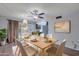 Light dining room with wooden table and access to backyard at 4121 W Medlock Dr, Phoenix, AZ 85019