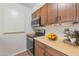 Kitchen features wood cabinets, modern appliances, and ample counter space at 4121 W Medlock Dr, Phoenix, AZ 85019