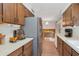 Updated kitchen with stainless steel appliances and wood cabinets at 4121 W Medlock Dr, Phoenix, AZ 85019