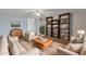 Bright living room featuring comfortable seating and built-in shelving at 4121 W Medlock Dr, Phoenix, AZ 85019