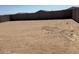 Spacious, dirt backyard surrounded by a privacy fence at 20331 N 225Th Dr, Surprise, AZ 85387