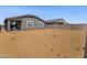 Spacious backyard with potential for landscaping and outdoor entertaining, enhancing the property's appeal at 20331 N 225Th Dr, Surprise, AZ 85387