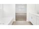 Bathroom featuring a bathtub, a sink and neutral paint color at 20331 N 225Th Dr, Surprise, AZ 85387