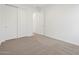 Inviting bedroom with plush carpet and ample closet space, offering comfort and functionality at 20331 N 225Th Dr, Surprise, AZ 85387
