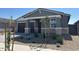 Charming single-story home featuring a stone accent facade and a two-car garage at 20331 N 225Th Dr, Surprise, AZ 85387