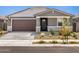 Charming single-story home featuring a two-car garage and well-maintained xeriscaped front yard at 20331 N 225Th Dr, Surprise, AZ 85387
