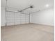 Spacious garage with an automatic door, providing ample room for vehicles and storage at 20331 N 225Th Dr, Surprise, AZ 85387