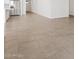 Open-concept living area featuring neutral tile flooring and an easy flow to the kitchen at 20331 N 225Th Dr, Surprise, AZ 85387