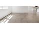 Living room featuring neutral tile flooring and bright natural light at 20331 N 225Th Dr, Surprise, AZ 85387