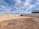 Large, empty backyard features a cinder block fence and potential for landscaping and outdoor living at 4256 W Jeanette Ln, San Tan Valley, AZ 85144