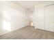 Carpeted bedroom featuring a closet with sliding doors and neutral-colored walls at 4256 W Jeanette Ln, San Tan Valley, AZ 85144