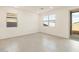 Bright bedroom with large windows, and tile flooring at 4256 W Jeanette Ln, San Tan Valley, AZ 85144