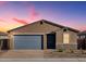 Charming single-story home with a blue garage door and a well-maintained front yard at 4256 W Jeanette Ln, San Tan Valley, AZ 85144