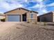 Charming single-story home with a blue garage door and a well-maintained front yard at 4256 W Jeanette Ln, San Tan Valley, AZ 85144