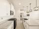 Kitchen boasts stainless steel appliances, granite counters and an island with sink at 4256 W Jeanette Ln, San Tan Valley, AZ 85144