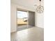 Bright living room features sliding glass door to backyard and modern light fixture at 4256 W Jeanette Ln, San Tan Valley, AZ 85144