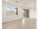 Open living space with large windows, sliding glass door, and modern lighting at 4256 W Jeanette Ln, San Tan Valley, AZ 85144