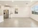 Bright and airy living room with tile flooring and natural light, adjacent to the kitchen area at 4256 W Jeanette Ln, San Tan Valley, AZ 85144