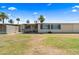 Backyard featuring desert landscaping, a fenced in patio and the home's exterior at 11038 W Windsor Dr, Sun City, AZ 85351