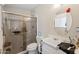 Bathroom features a glass-enclosed shower and a classic vanity at 11038 W Windsor Dr, Sun City, AZ 85351