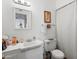 Traditional bathroom with white fixtures, ample counter space, and a shower-tub combo at 11038 W Windsor Dr, Sun City, AZ 85351