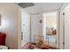 Hallway featuring multiple doorways, a closet, and transitions to other rooms in the house at 11038 W Windsor Dr, Sun City, AZ 85351