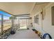 Covered patio area with secure fencing and space for outdoor living at 11038 W Windsor Dr, Sun City, AZ 85351