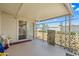 Enclosed back patio with a sliding glass door and security fencing at 11038 W Windsor Dr, Sun City, AZ 85351