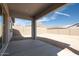 Covered patio overlooking a spacious and private backyard at 4780 W Flat Iron Ct, Queen Creek, AZ 85144