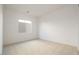 Clean, carpeted bedroom with a bright window for natural light at 4780 W Flat Iron Ct, Queen Creek, AZ 85144